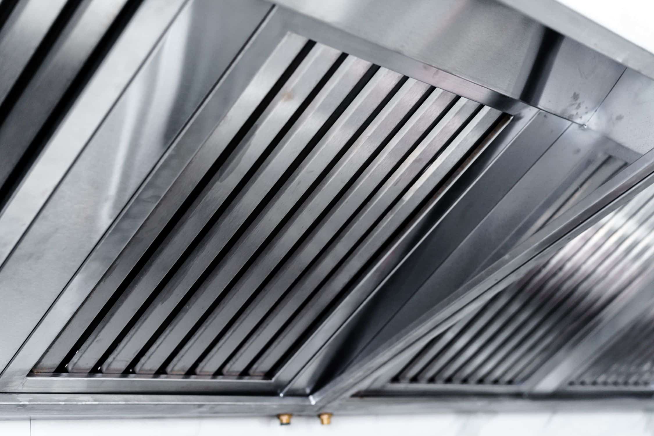 Commercial extractor fan hood in restaurant kitchen